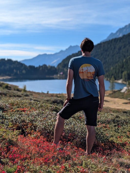 Half Dome men's t-shirt with large back print, worn on an autumn hike by an alpine lake