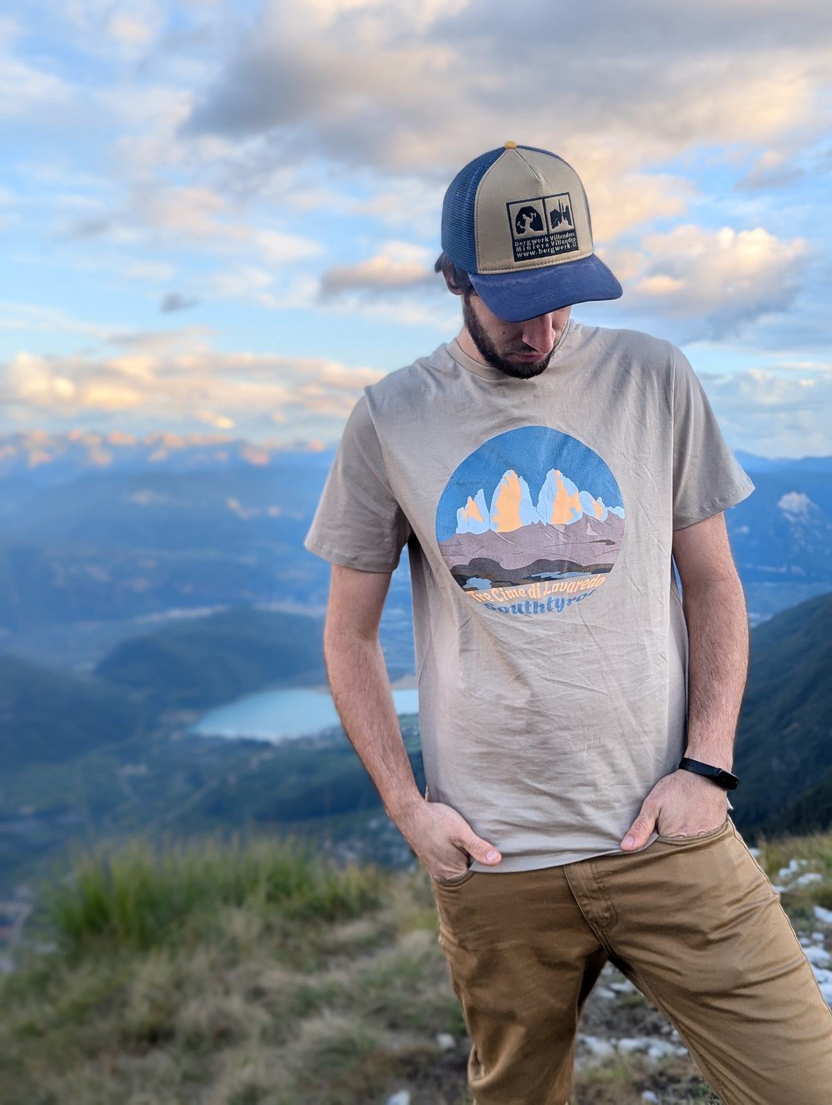 Tre Cime di Lavaredo men's t-shirt in heather dust worn on a mountain ridge above the Dolomites – Silly Craic