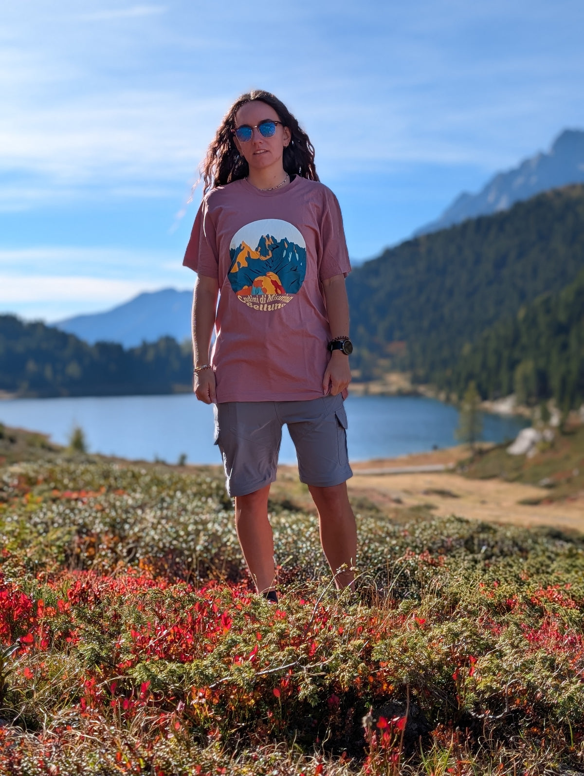 Cadini di Misurina t-shirt with front print, worn oversized by her on an autumn hike by an alpine lake
