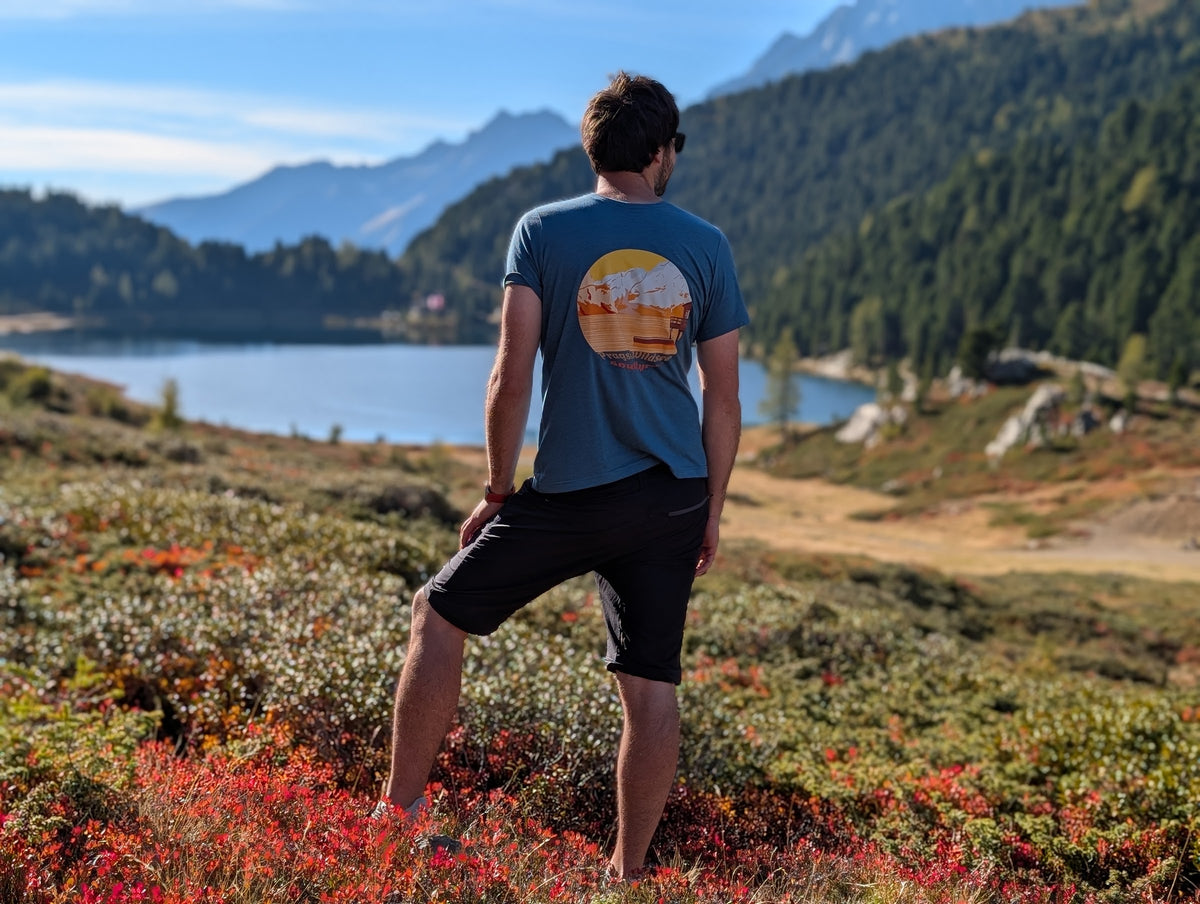 Half Dome men's t-shirt with large back print, worn on an autumn hike by an alpine lake