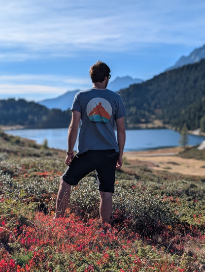 Passo Giau men's t-shirt with large back print, worn on an autumn hike by an alpine lake