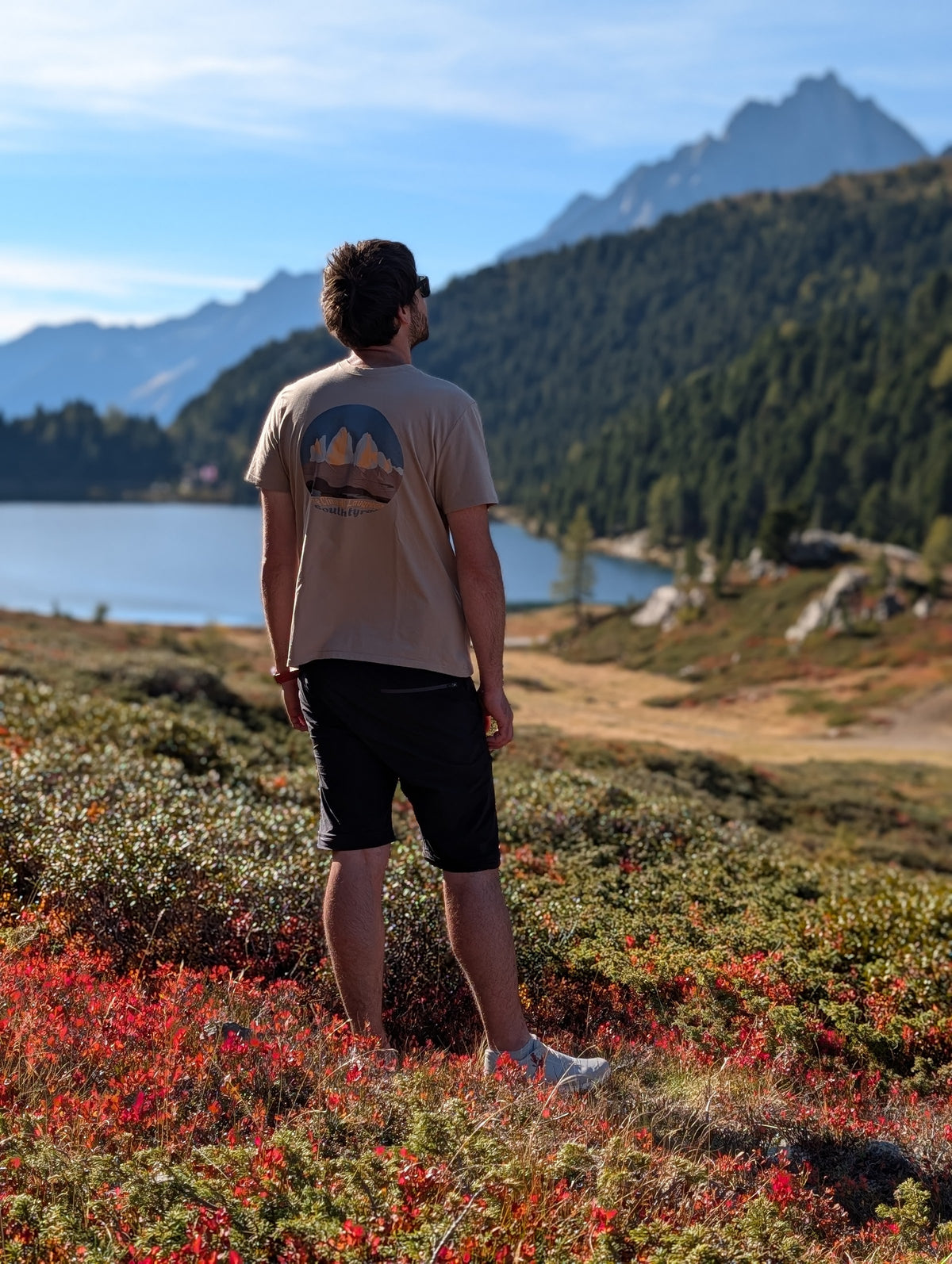 Tre Cime di Lavaredo men's t-shirt with large back print, worn on an autumn hike by an alpine lake