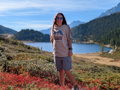 Tre Cime di Lavaredo t-shirt with front print, worn oversized by her on an autumn hike by an alpine lake