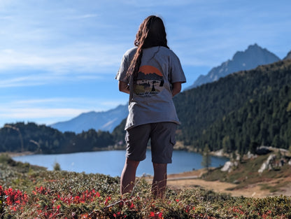 Alpe di Siusi t-shirt with large back print, worn oversized by her on an autumn hike by an alpine lake