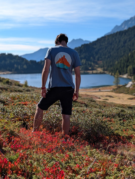 Passo Giau men's t-shirt with large back print, worn on an autumn hike by an alpine lake
