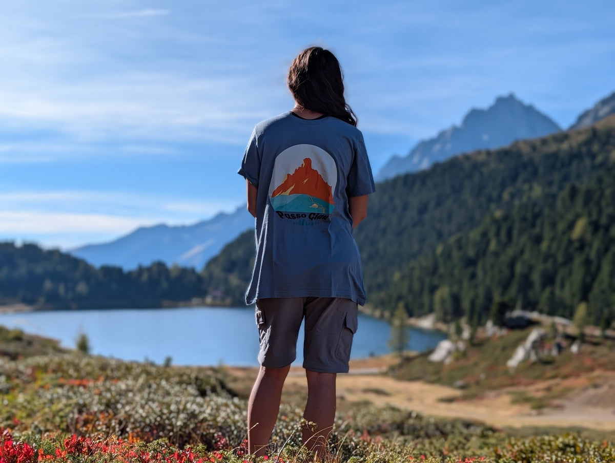 Passo Giau t-shirt with large back print, worn oversized by her on an autumn hike by an alpine lake