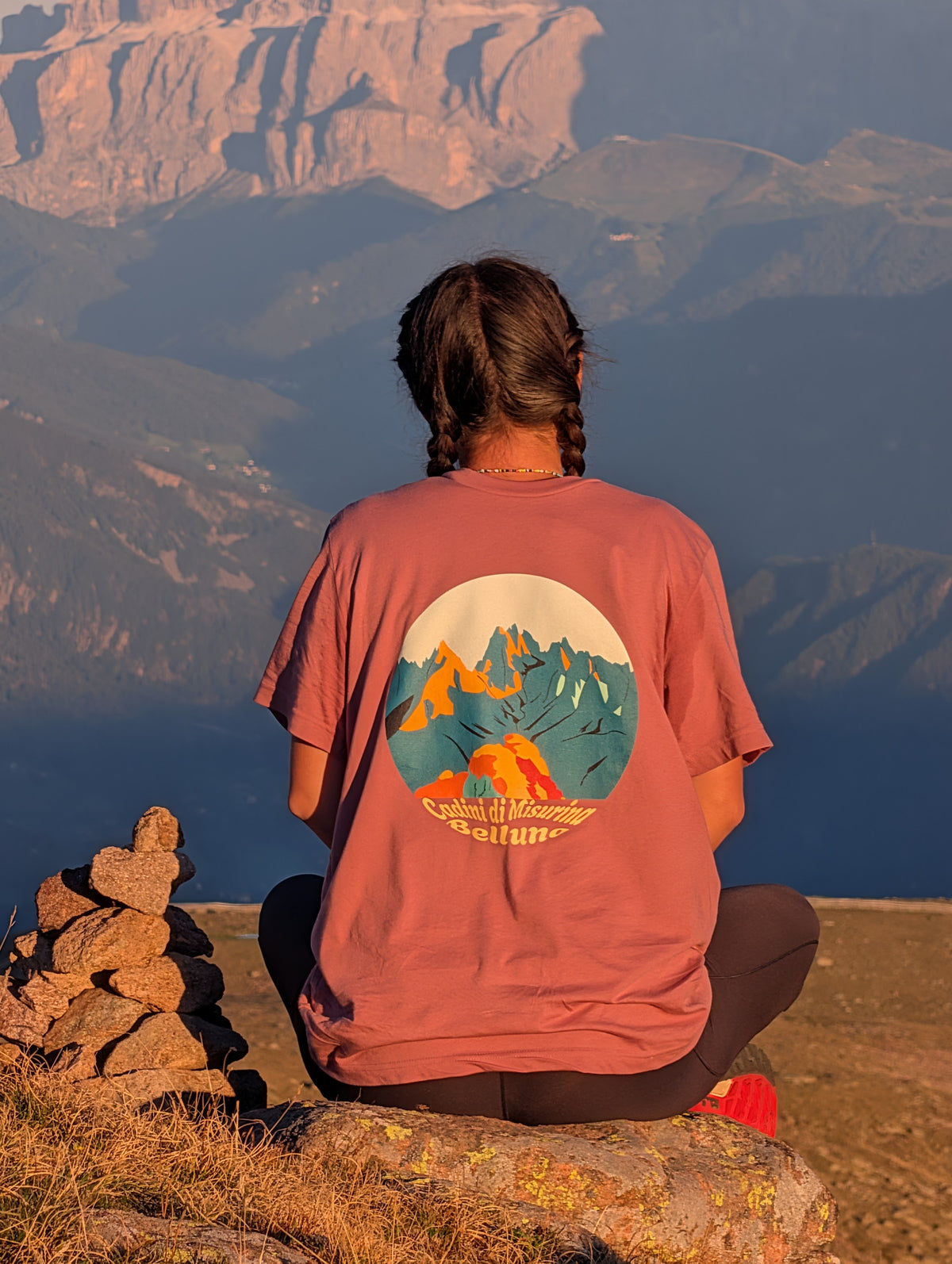 Cadini di Misurina back print – sitting by a cairn at sunset