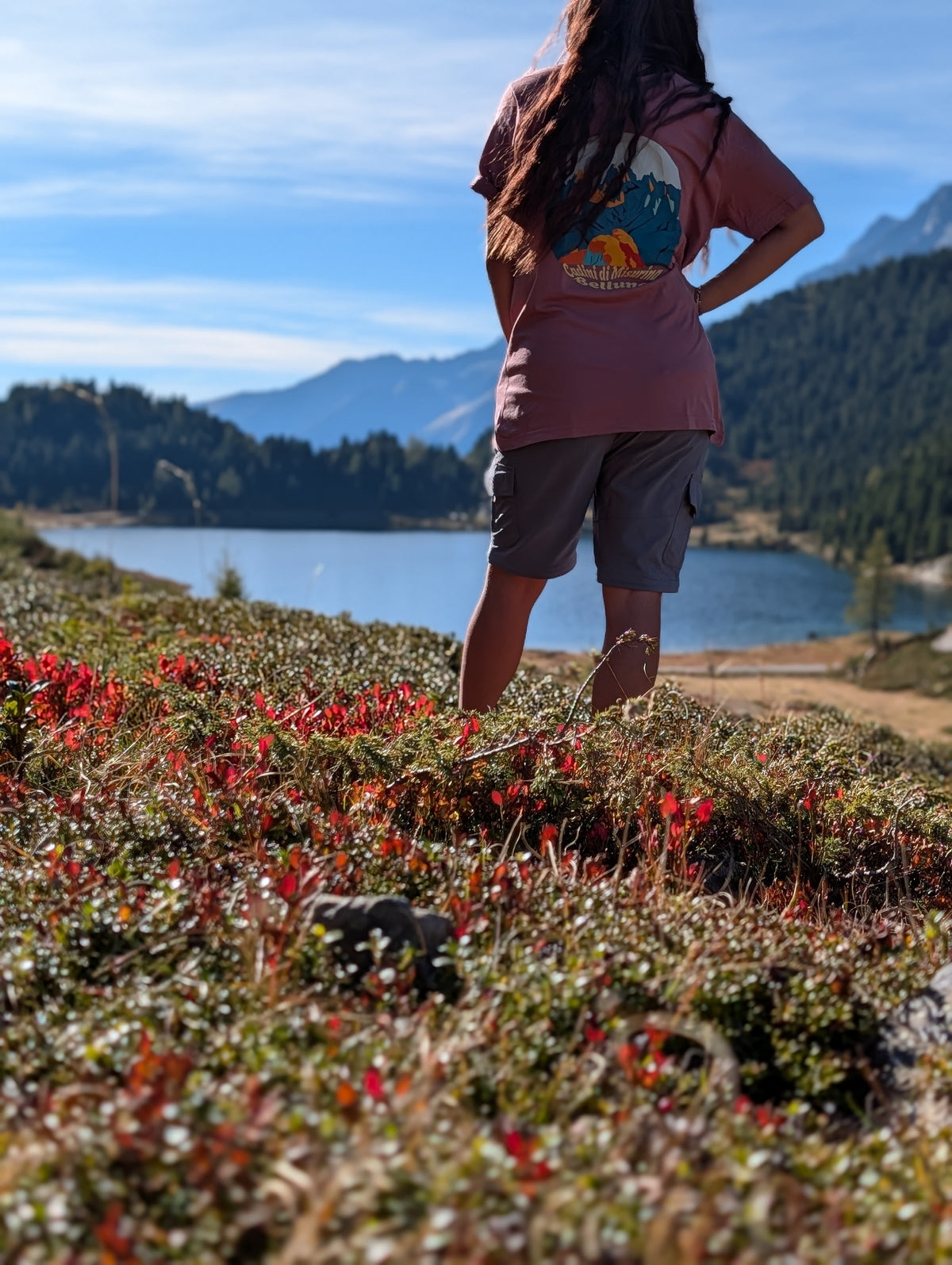 Cadini di Misurina t-shirt with large back print, worn oversized by her on an autumn hike by an alpine lake