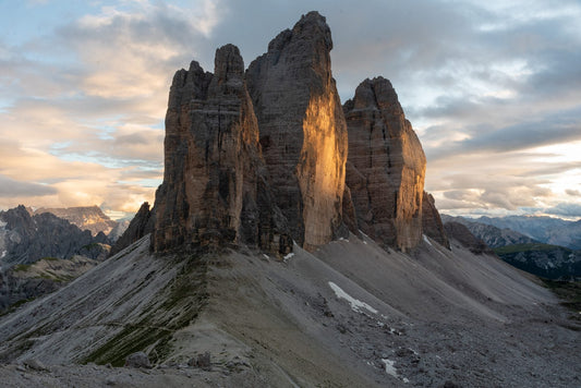 Sunset over the Tre Cime di Lavaredo north faces – the peaks behind the Silly Craic design